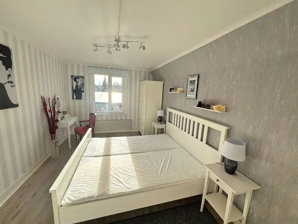 Schlafzimmer mit Einzelbetten im Ferienhaus beim Michel in Järnforsen