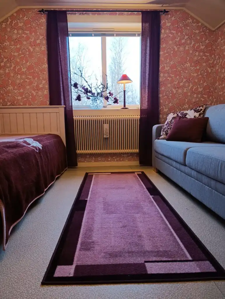 Schlafzimmer im Ferienhaus Hus Fee – gemütlicher Schlafbereich im Schwedenhaus